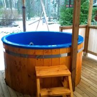 small wood-fired hot tubround model for 4 personswith